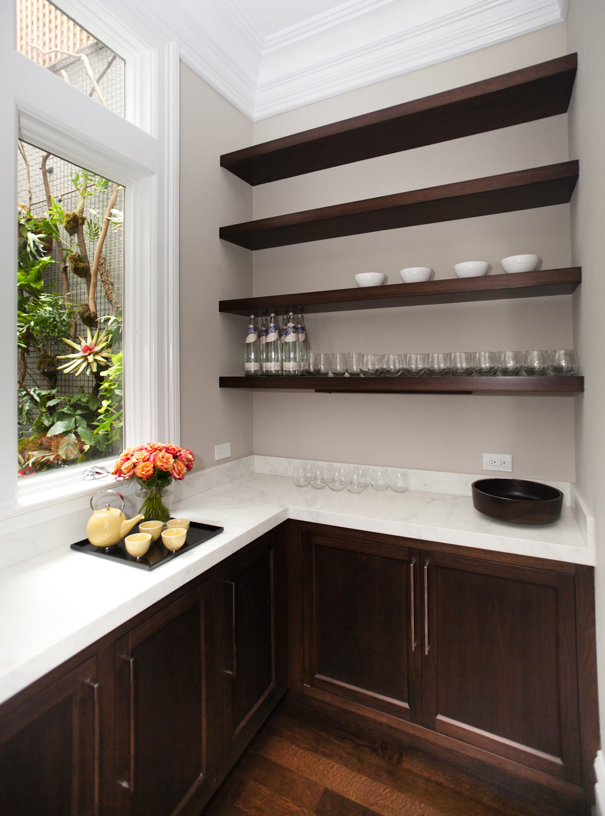 bar, cabinetry, door pulls, marble counters, garden wall, hanging plant wall, floating shelves, hardwood floors