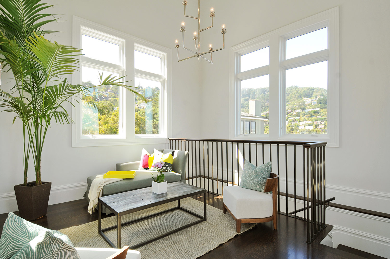 sitting room , reading room, chaise, lounge, attic remodel, natural light, hardwood floors, stair railing
