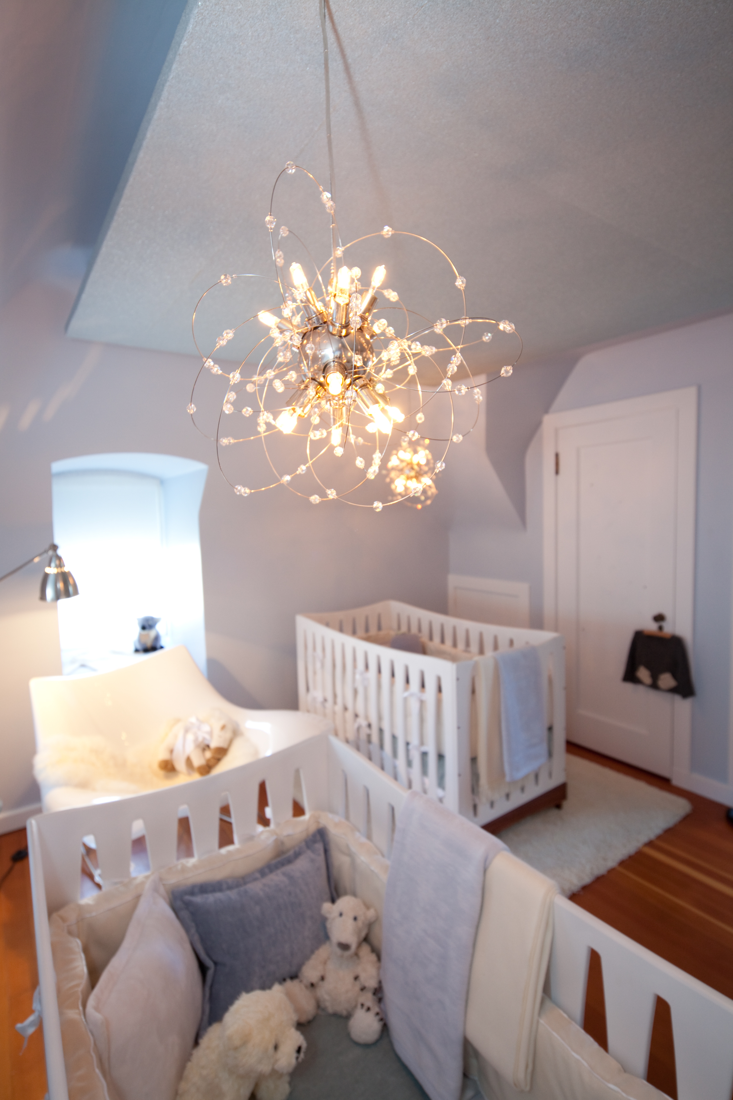 nursery, crib, modern, light, white, baby blue, chandelier, elegant, open, soft tones, soft textures 