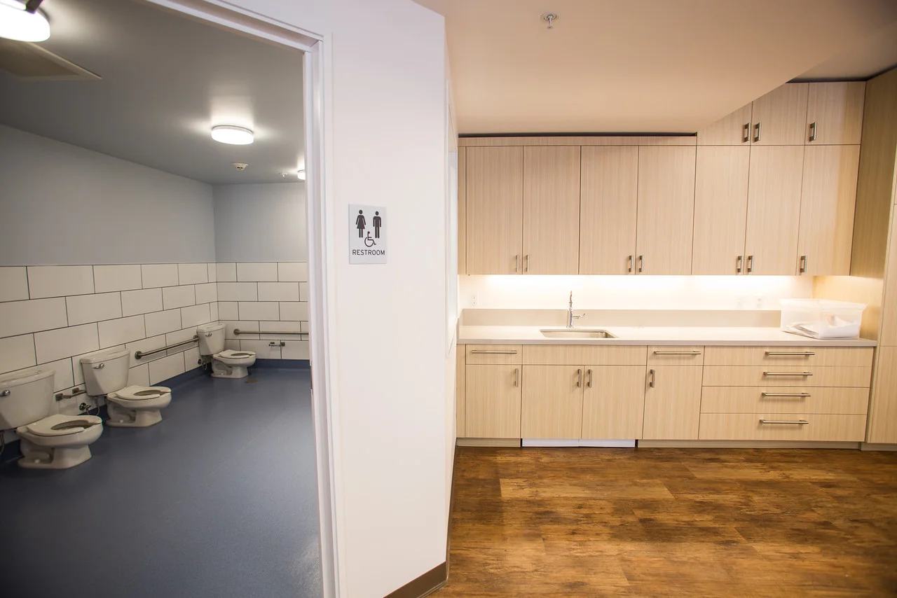 open, modern, white, clean, san francisco school, elementary, architecture, children's space, bathroom, subway tiles, locker, wood