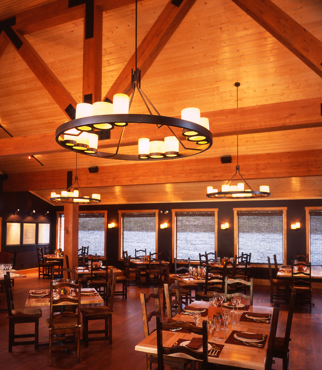 wyoming, wood, lake, lodge, leather, seating, dining room, rich textures, warm tone, rustic, western, chandelier, open layout