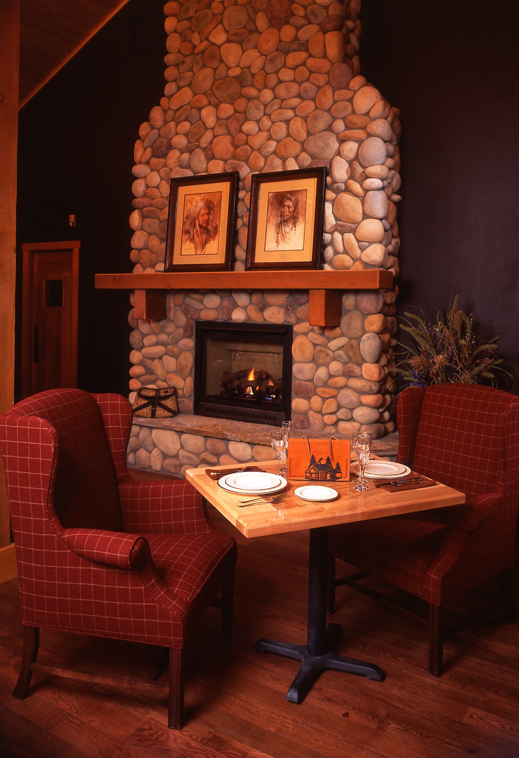 wyoming, lodge, wood, stone fireplace, dark textures, dark tones, hardwood floors, dining table 