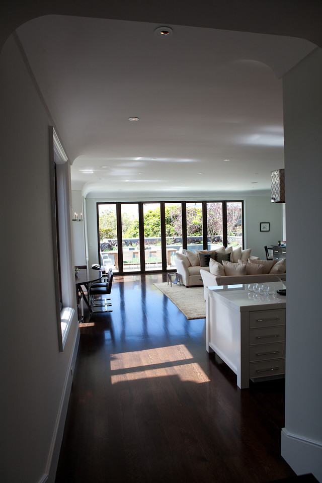 kitchen to living room, open floor plan, details, island, marble, dark floors, airy, soft tones