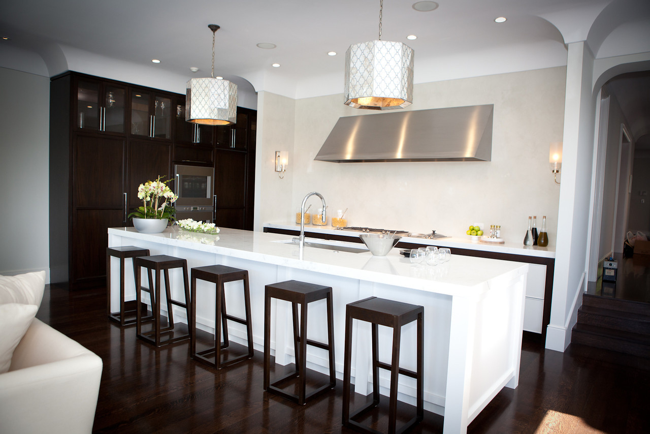 kitchen, modern kitchen, marble counters, stove top, range, stainless steel, kitchen cabinetry, kitchen island, barstools, pendant lights
