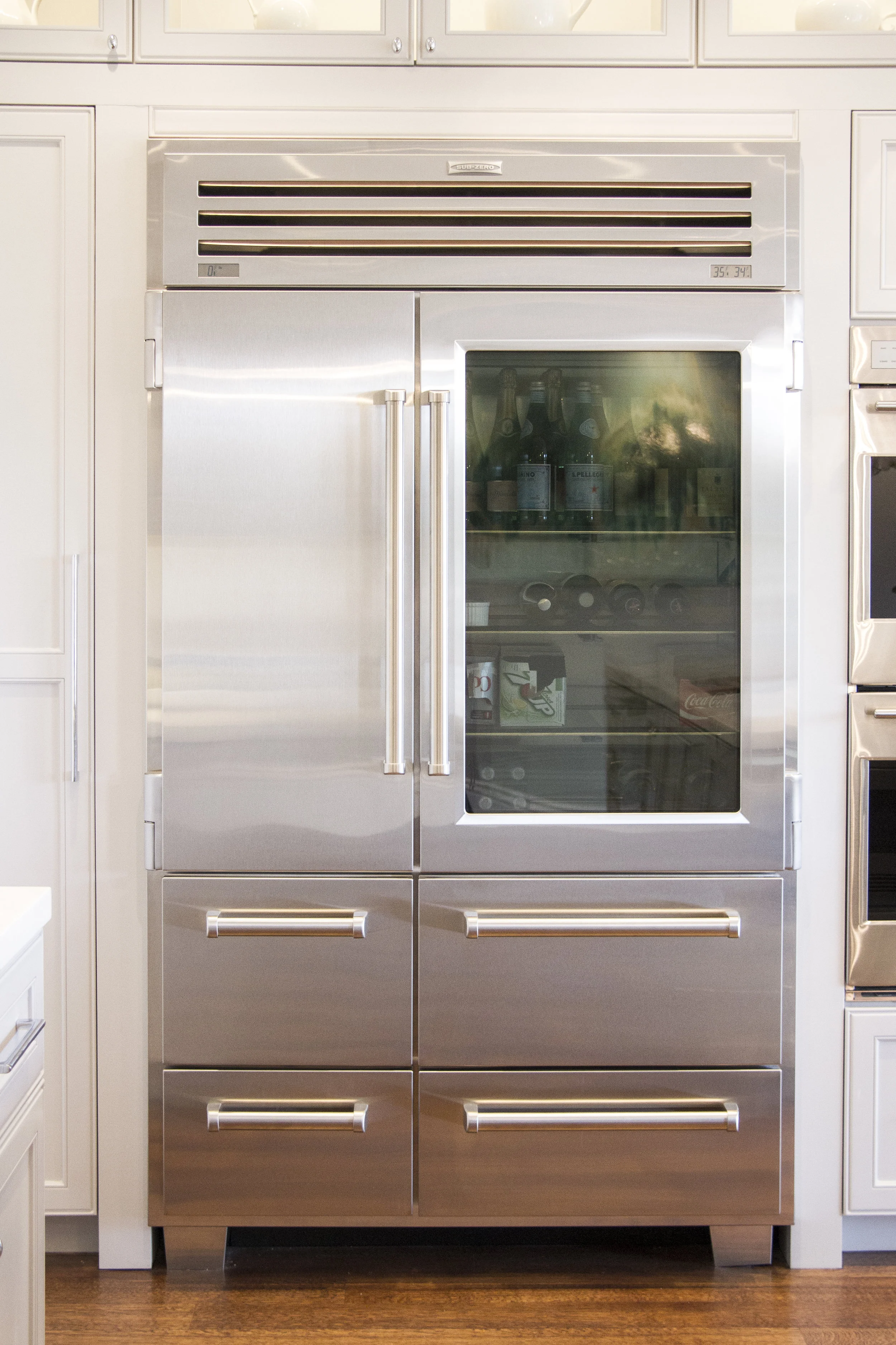 kitchen, fridge, stainless steel, white kitchen, simple, lighting, window cabinets, hardwood floor 