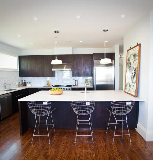 kitchen, barstools, kitchen island, marble counters, tile backsplash, stainless steel appliances, modern kitchen, dark cabinets