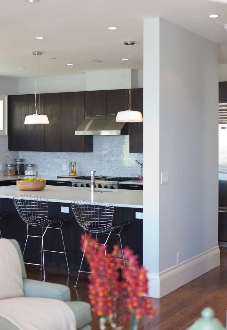 kitchen, barstools, kitchen island, marble counters, tile backsplash, stainless steel appliances, modern kitchen, dark cabinets, polished chrome faucet, kitchen sink, prep sink