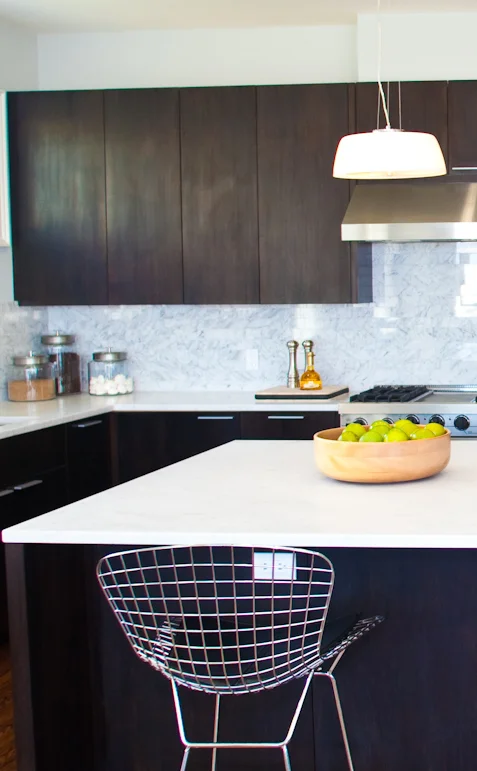 kitchen, barstools, kitchen island, marble counters, tile backsplash, stainless steel appliances, modern kitchen, dark cabinets, polished chrome faucet, kitchen sink, prep sink