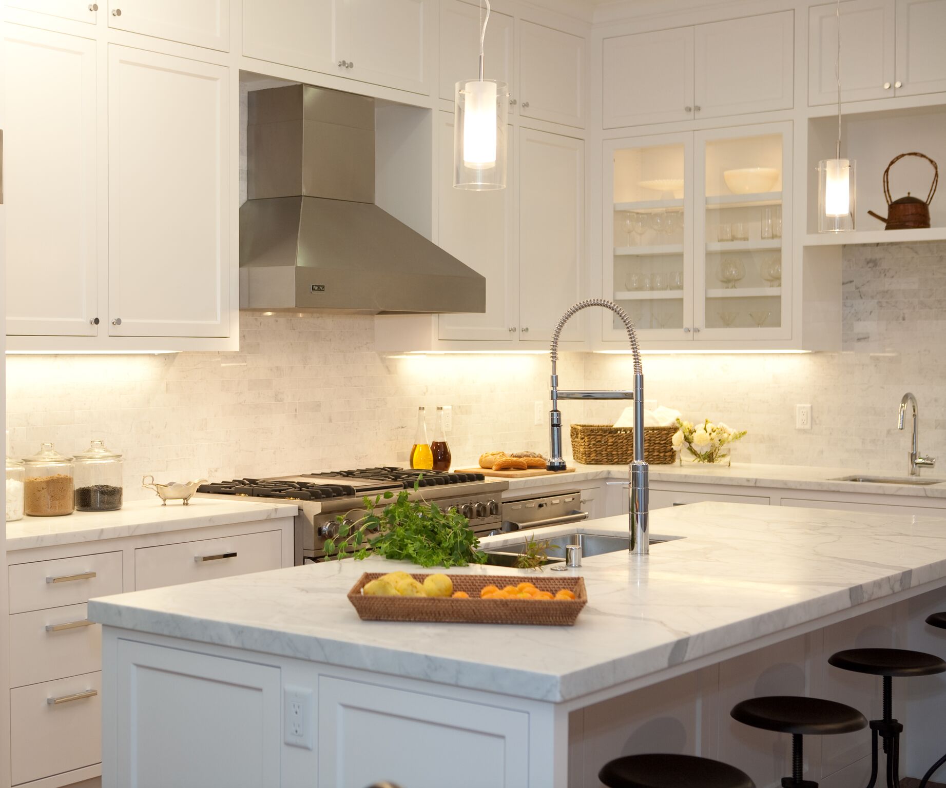 kitchen, bar stools, breakfast nook, stainless steel appliances, carerra marble counters, subway tile backsplash