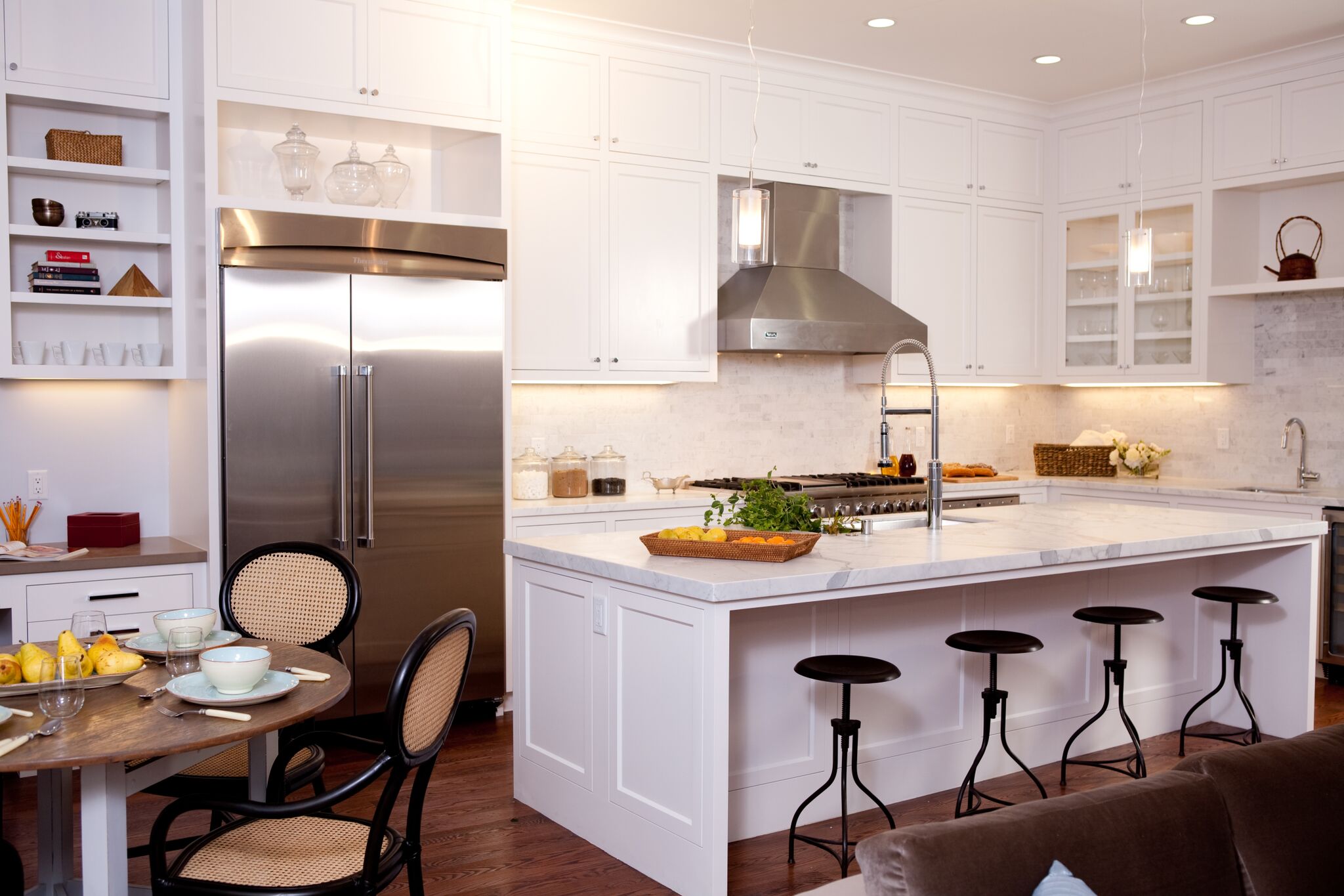 kitchen, barstools, breakfast nook, stainless steel appliances, carerra marble counters, subway tile backsplash