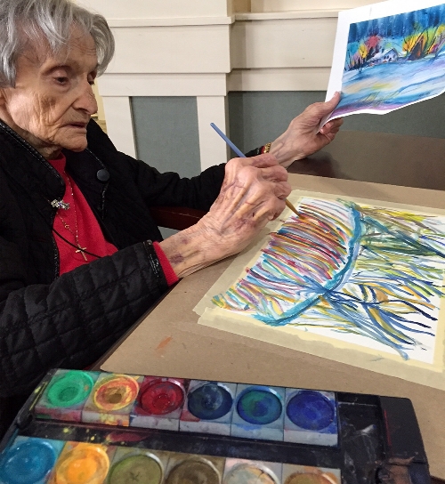 My mom painting in a Memories in the Making Class. 