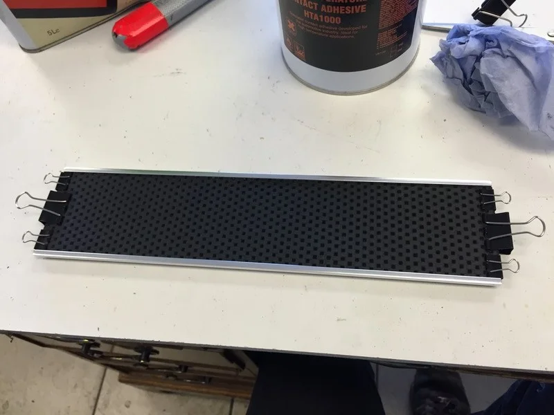 Glued in place and held the edges down with bulldog clips. 