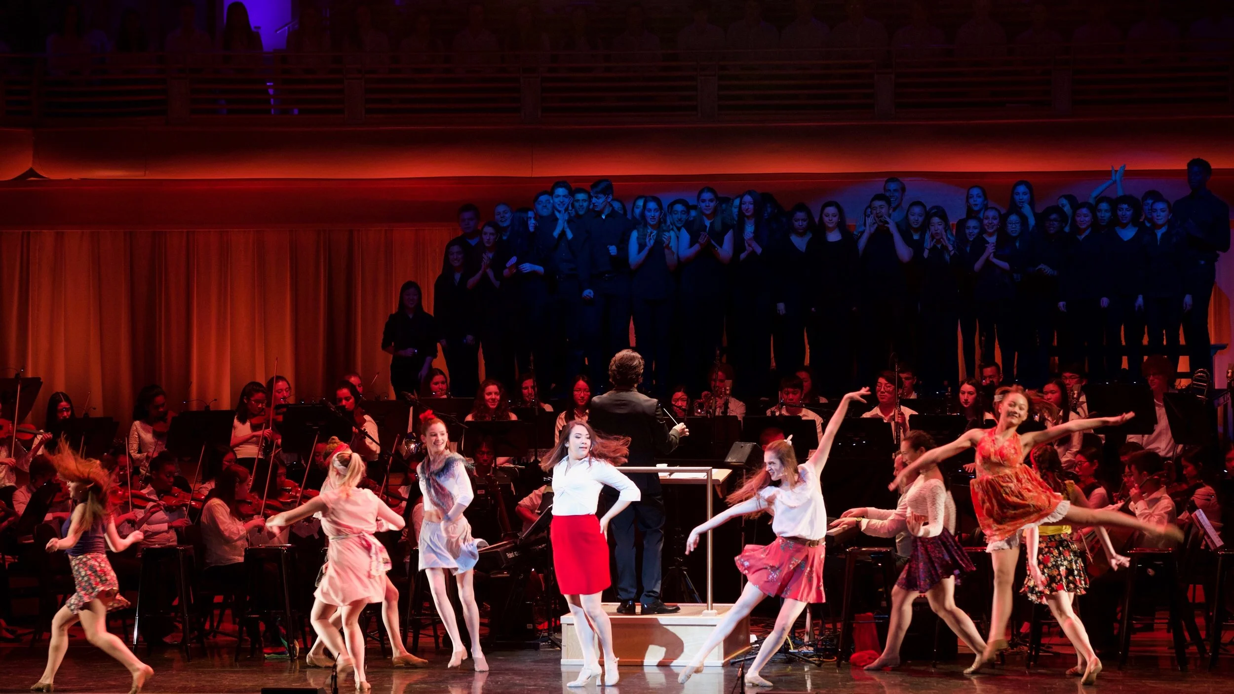 Chani (center in red skirt) on stage at YAA's The Circle of Life.
