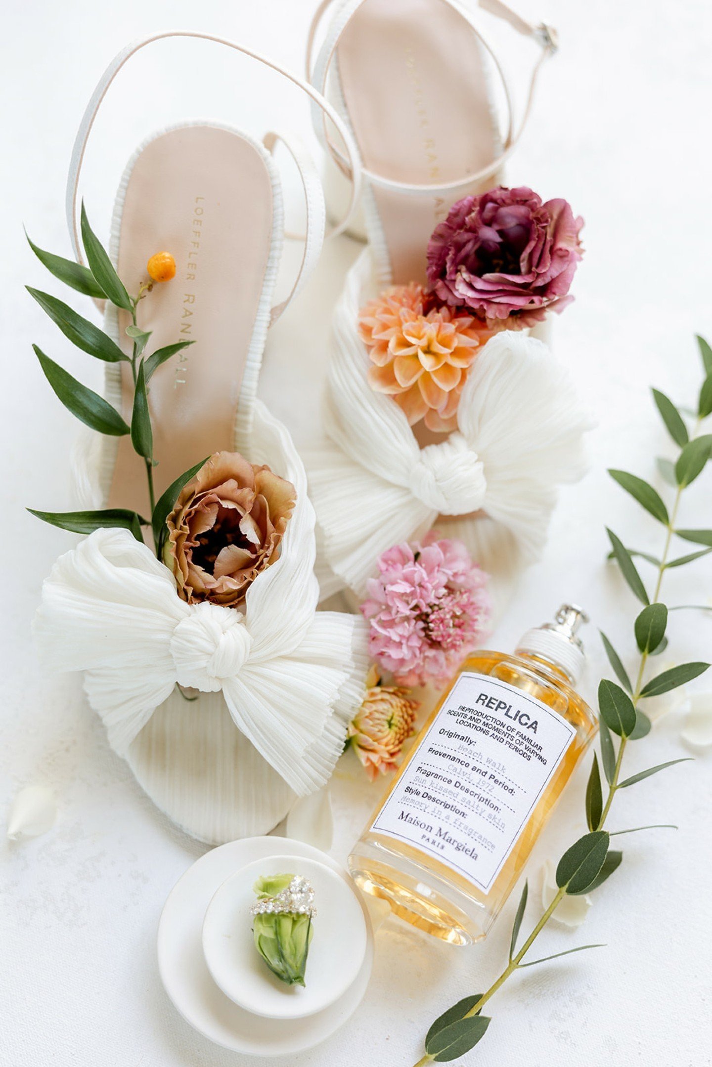 One of our favorite detail shots from every wedding is the flat lay of the bride's personal details. We love the integration of her perfume in this shot by  the amazing @kylieandcompany. Such a great way to memorialize it! 

Siena and Chris' Vendors: