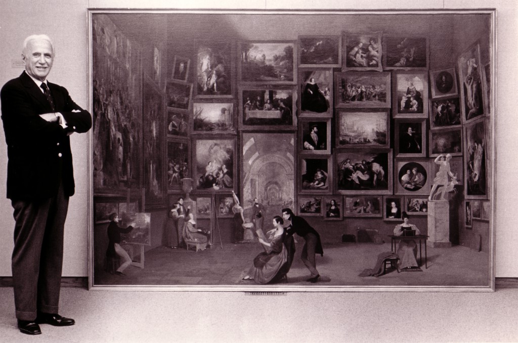 Daniel Terra, of the Terra Foundation, posing with The Gallery of the Louvre upon its purchase