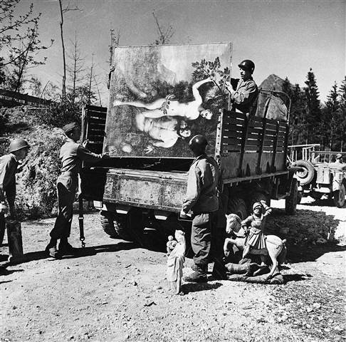 Unidentified military personnel unload some of the art treasures recovered from Hermann Goering's cave in the mountain side at Konigsee in May 1945.  Keystone Pool via AP file