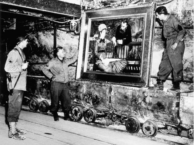 Soldiers pose with a looted painting by Manet discovered in a mine by men of the U.S. Army's 90th Division April 7, 1945. COURTESY JOHN PROVAN