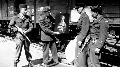 Everett Parker Lesley, Jr. (left) returning Leonardo da Vinci's "Lady with an Ermine" to its home in Cracow, Poland in 1946.  Courtesy of the Monuments Men Foundation