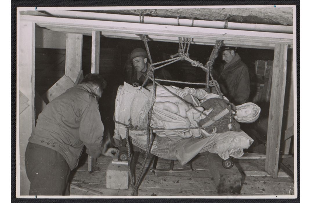 Stephen Kovalyak, George Stout and Thomas Carr Howe transporting Michelangelo's sculpture Madonna and child, July 9, 1945