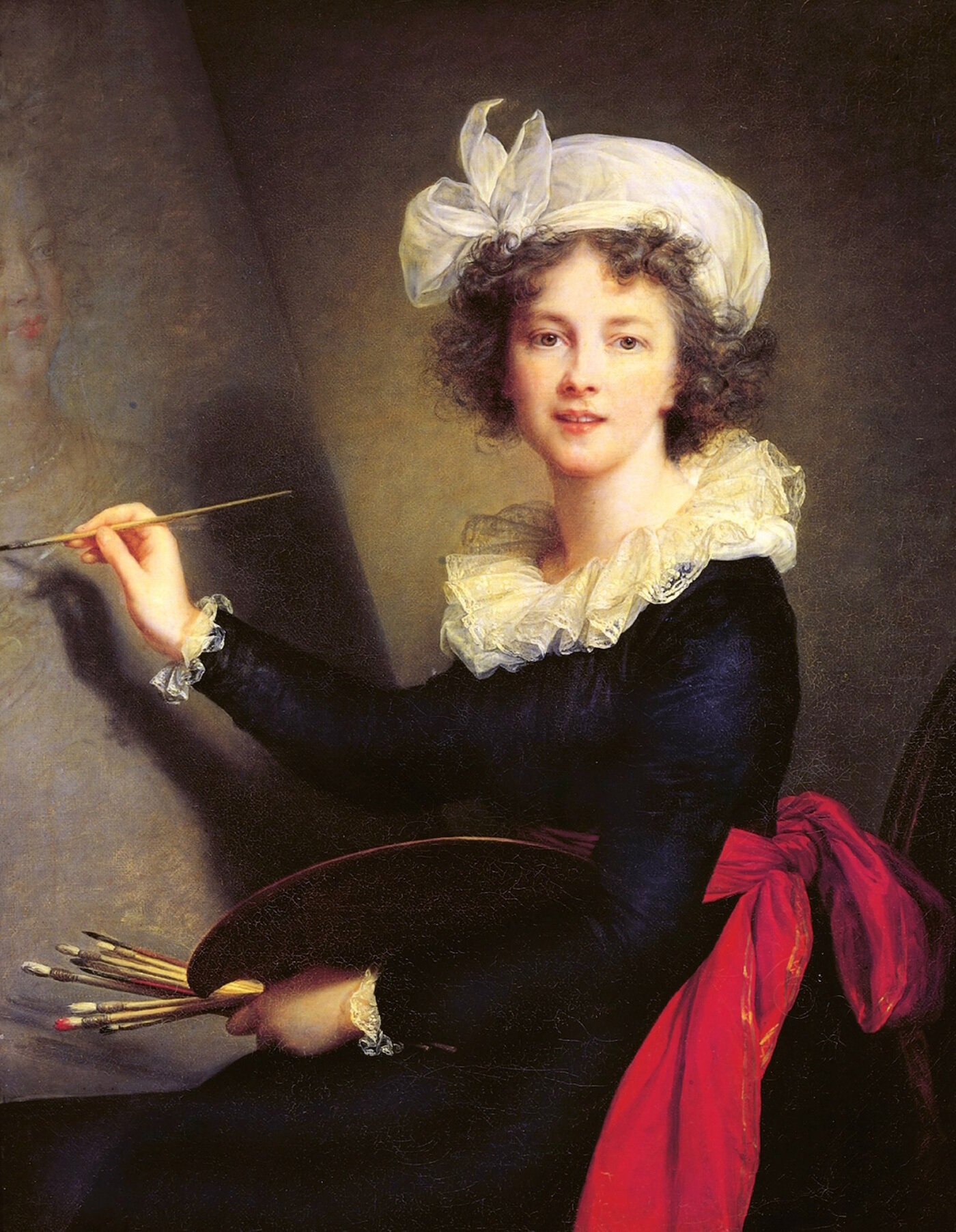  Brown-haired woman painting at an easel and wearing a white hat 