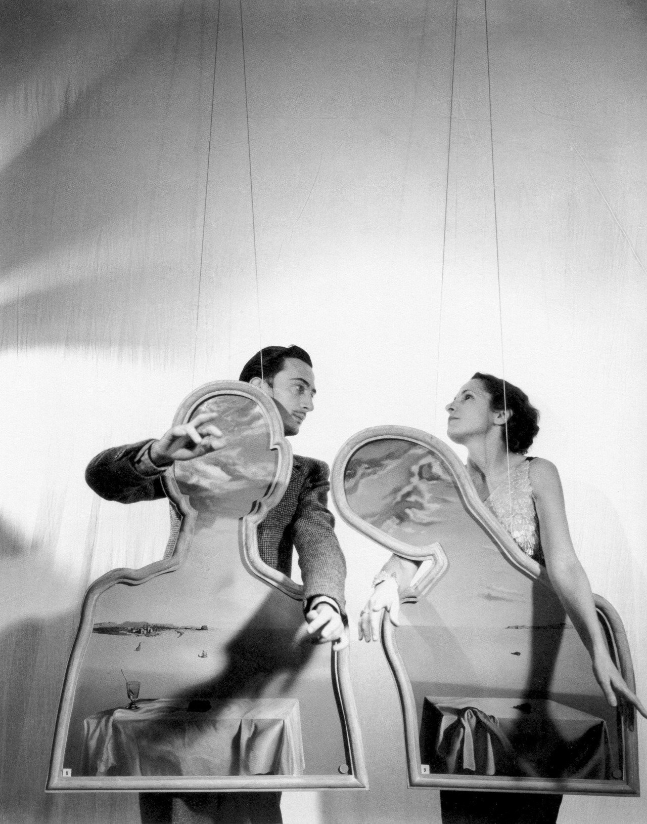 Salvador and Gala Dali photographed by Cecil Beaton with Dali’s Couple with their Heads Full of Clouds, 1936.jpg