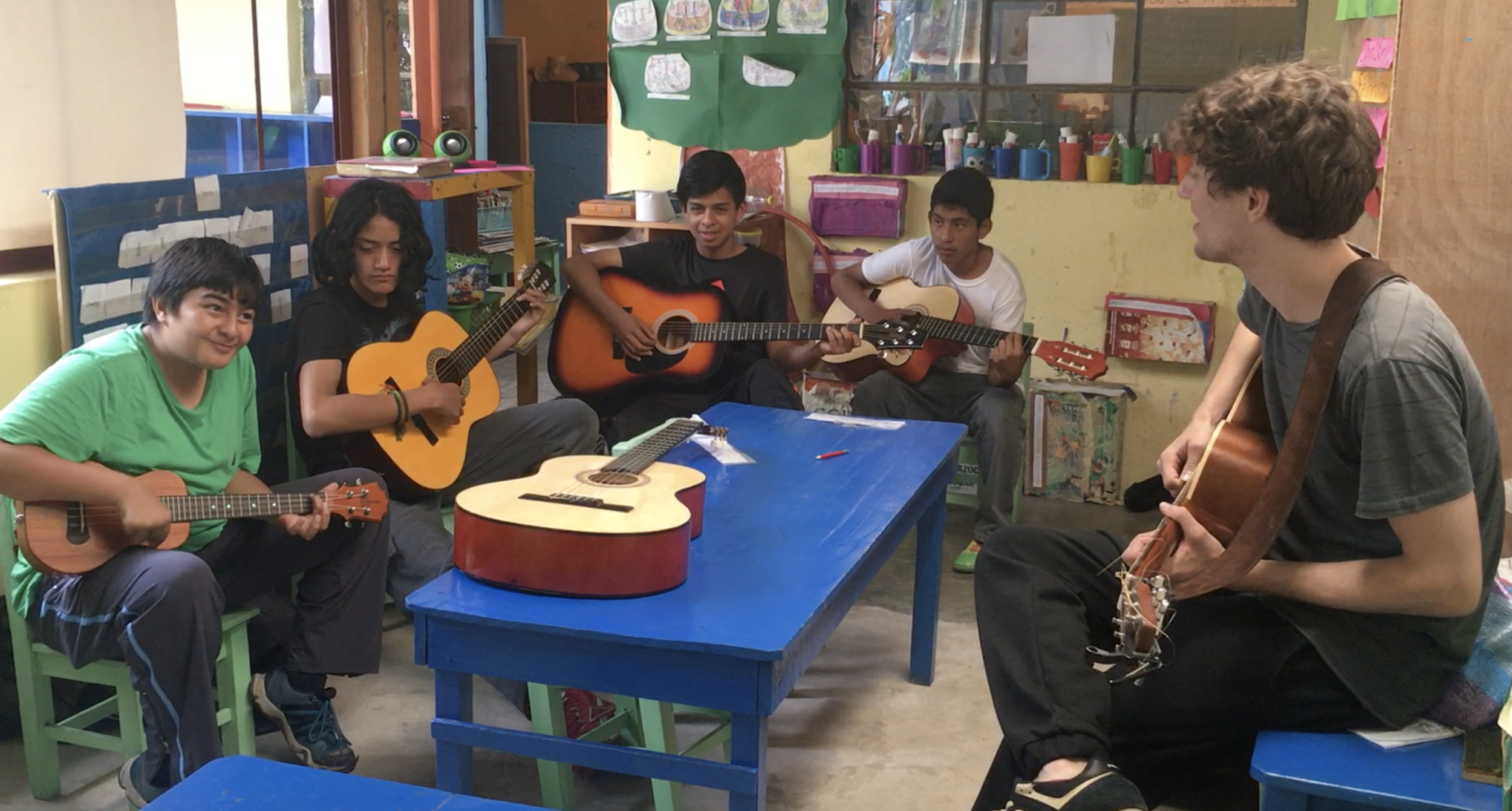 Teaching group guitar and Ukulele lessons to the 7th graders at Robert Muller Life School, Guatemala