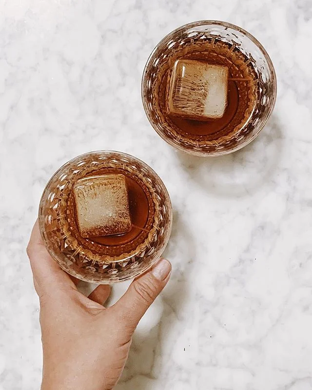 Cozy old fashioneds on a rain Friday night. A little bit of whiskey, a little bit of pear liqueur, a few dashes of black walnut bitters.