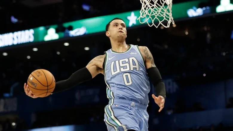 Lakers Forward Kyle Kuzma performs a ferocious slam dunk in the first half. (AP Photo/ CBC SPORTS)