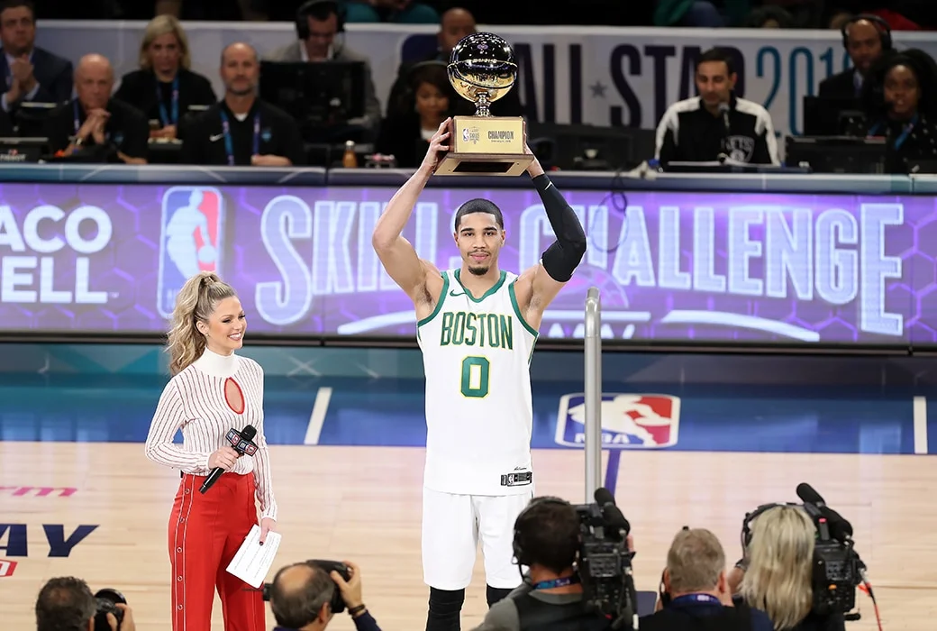 Celtics Forward Jayson Tatum hold the Skills Challenge Trophy in Charlotte,NC ( AP Photo/ SLAM MAG)