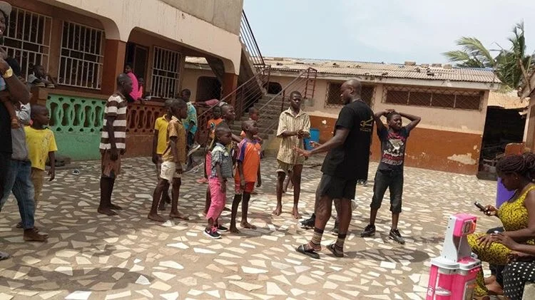 CEO Randy Osei imparting his knowledge back to the residents in Ghana. (Photo by: RozaayMGMT)