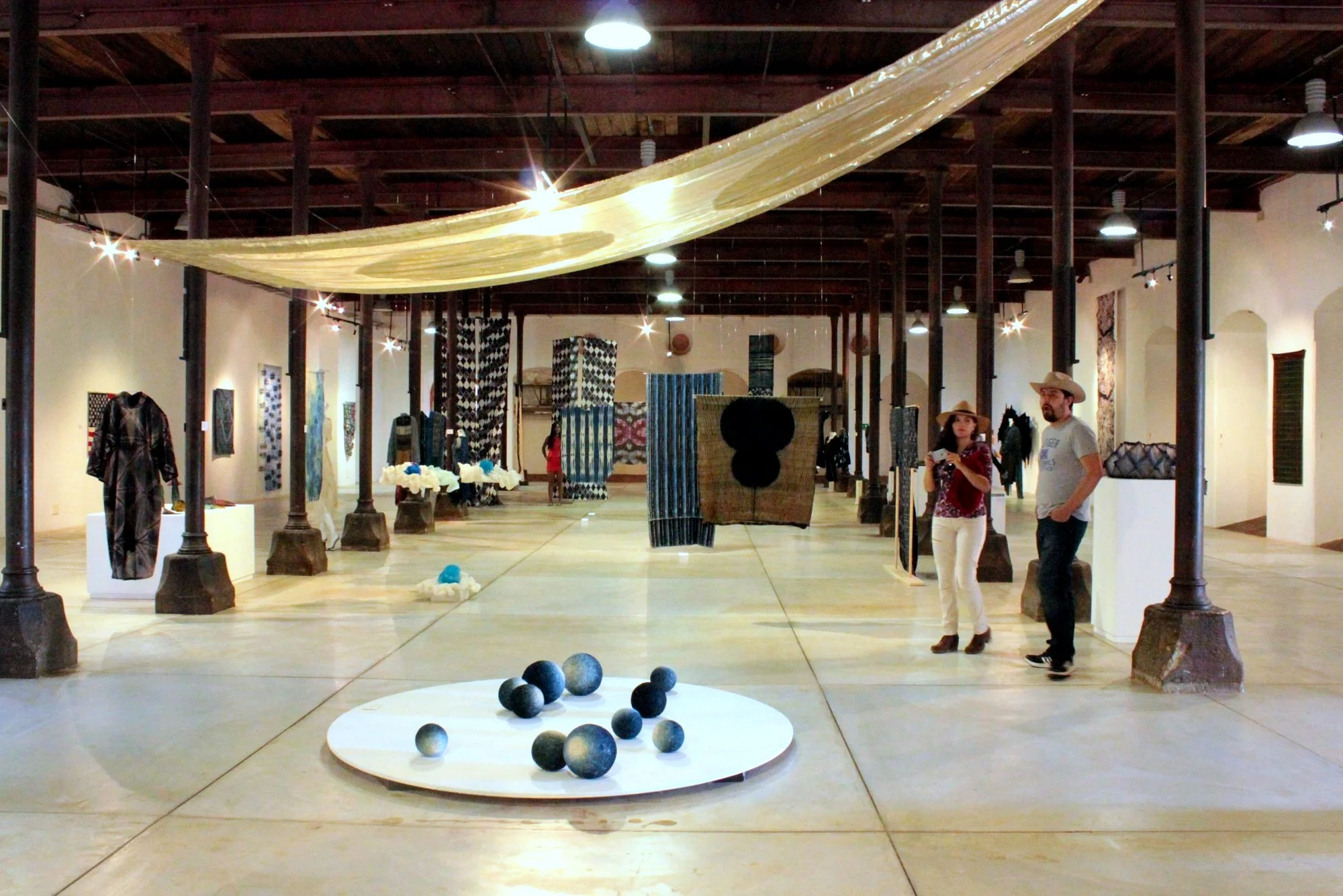 View of one end of the exhibit, all in shades of indigo