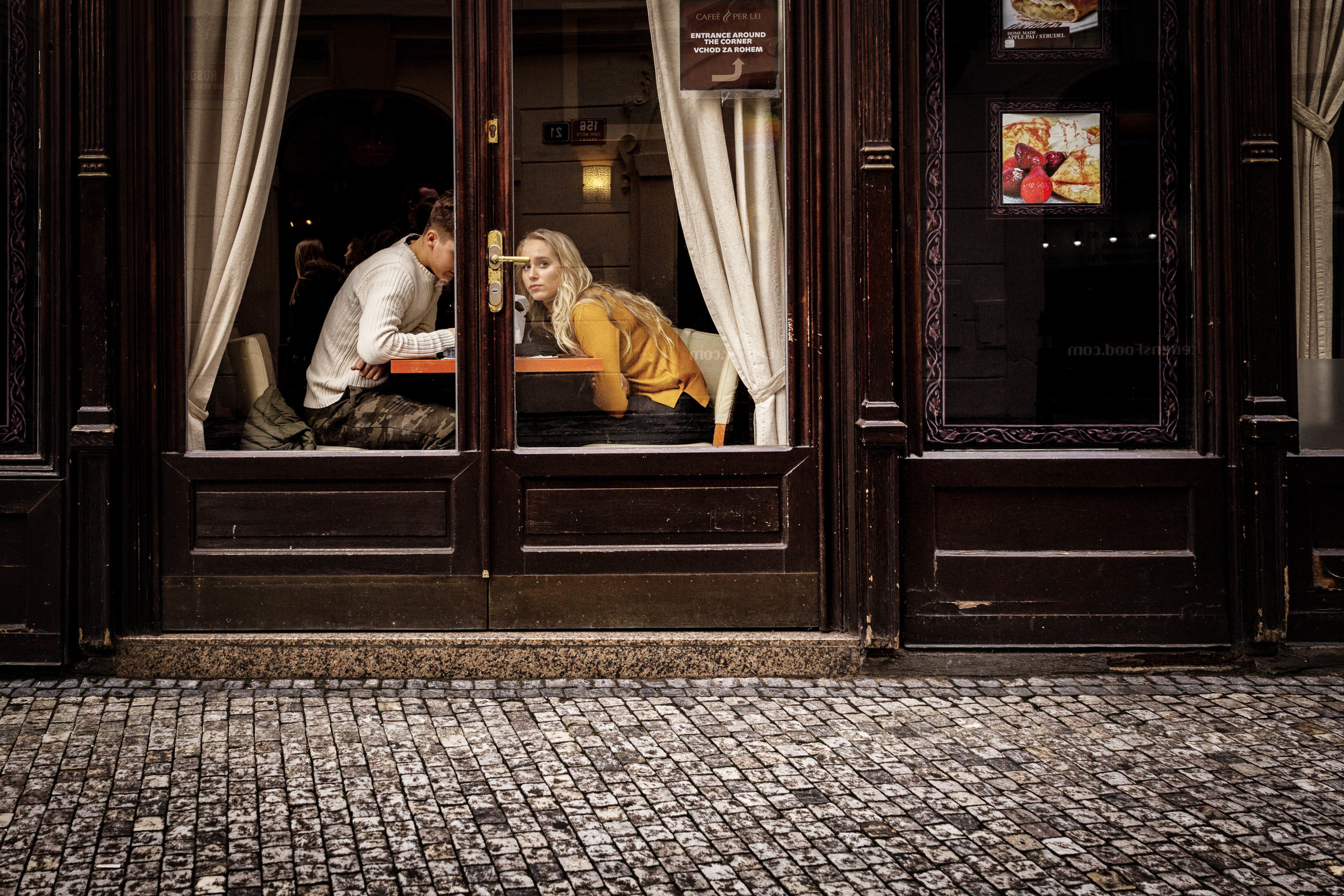 Cafe Stop. Prague, October 2016. Luckily turned back at just the right moment to catch this. Love the colours and the fact that she wondered whether I was really taking their picture. Of course I was. How could I not?
