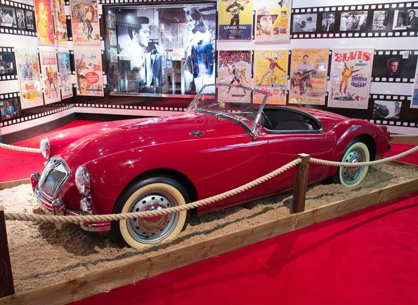 The MGA appeared in the movie“Blue Hawaii” with Elvis Presley, (He liked the car so much, he bought it and it now resides at Graceland.).