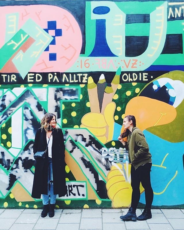 Author + friend + cool wall painting.