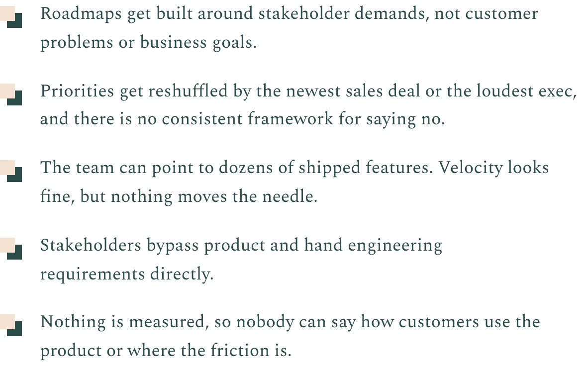 Close-up of a slide or presentation with bullet points about product development challenges, including stakeholder demands, reshuffled priorities, shipped features, bypassing engineering, and unmeasured customer use.