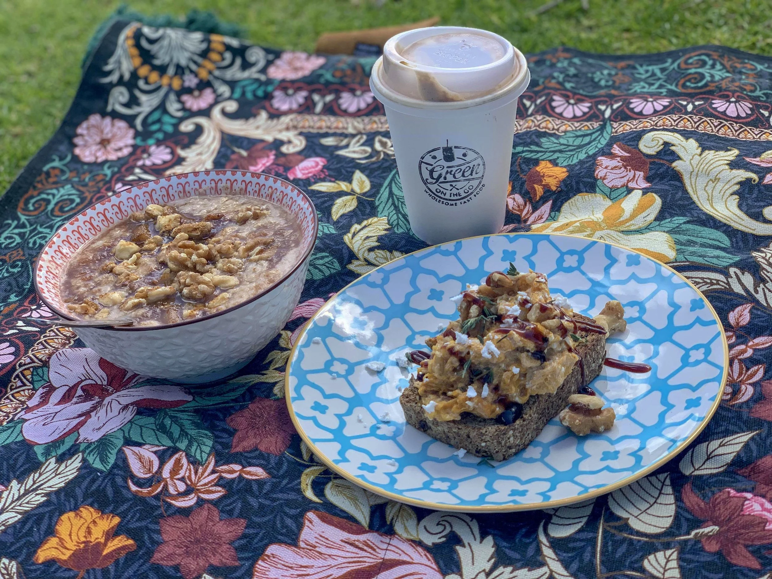 Sit on the grass and eat your lunch with reusable plates