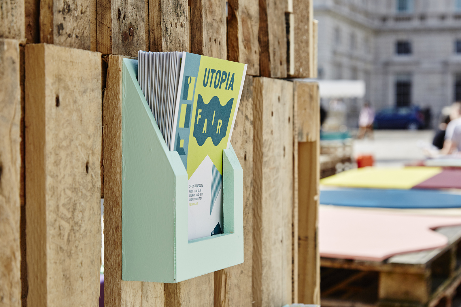 Materials used were carefully selected - recycled paper for leaflets, cotton for festive flags and recycled palettes for the communal table and interactive information tower.