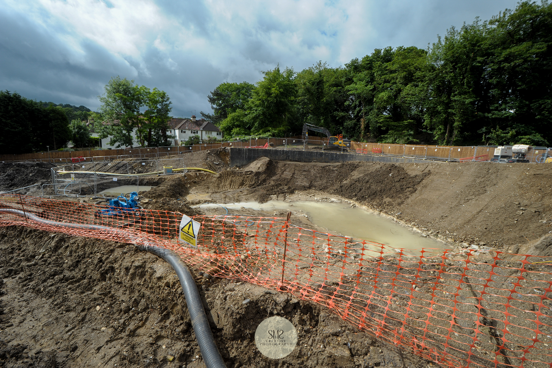 The water from the recent rain downfall shows the tubing to drain this from the site.