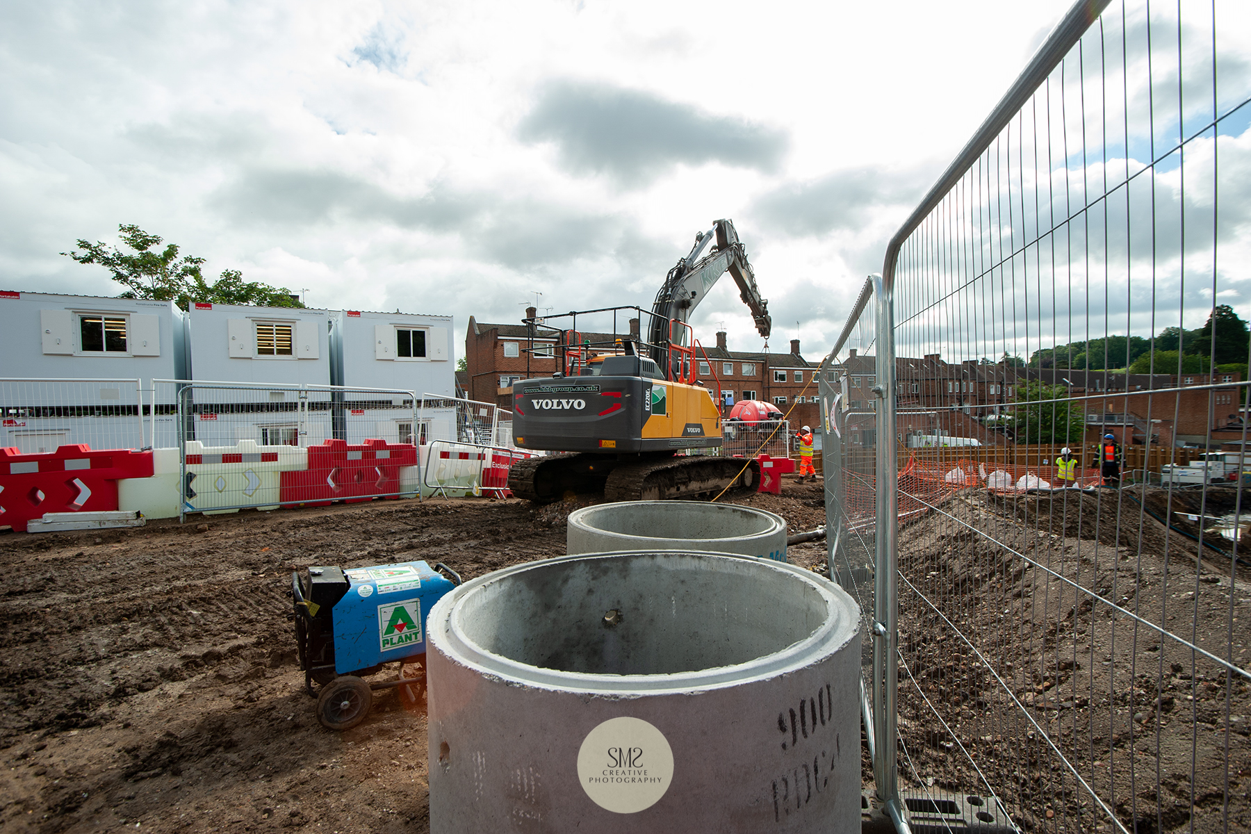 Machinery at work, on the left the porta cabins that houses a team of professionals.