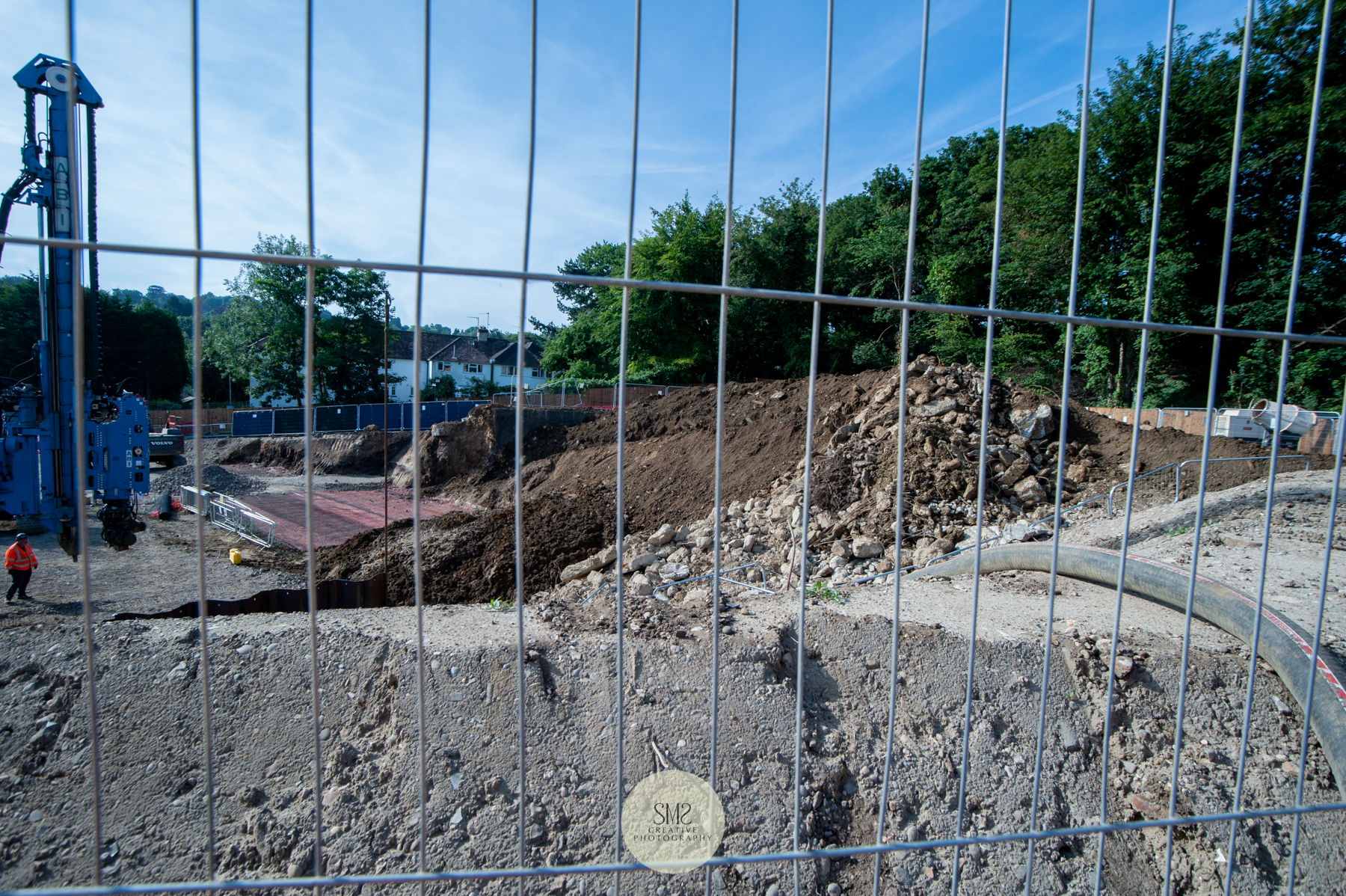 Looking down the site, a hose on the right, is visible to drain out the excess water