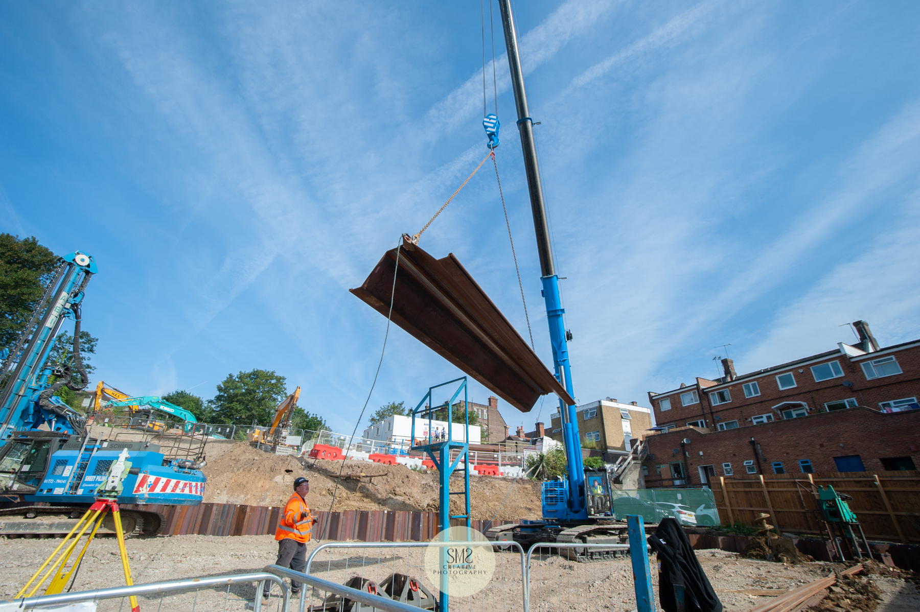 Each piling sheet is lifted by crane from the delivery lorry with the guidance of the engineers to lower in place