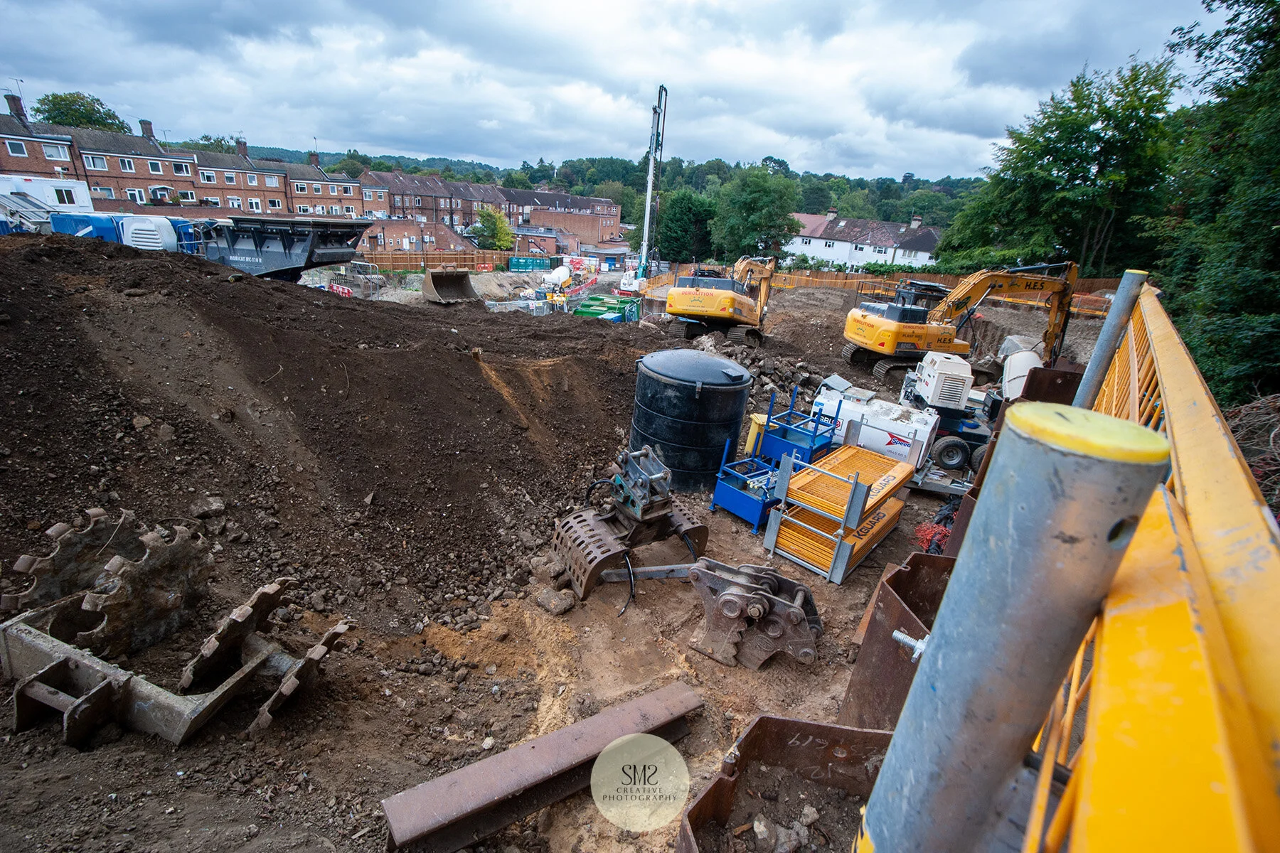 The top of the site behind the railway tracks.