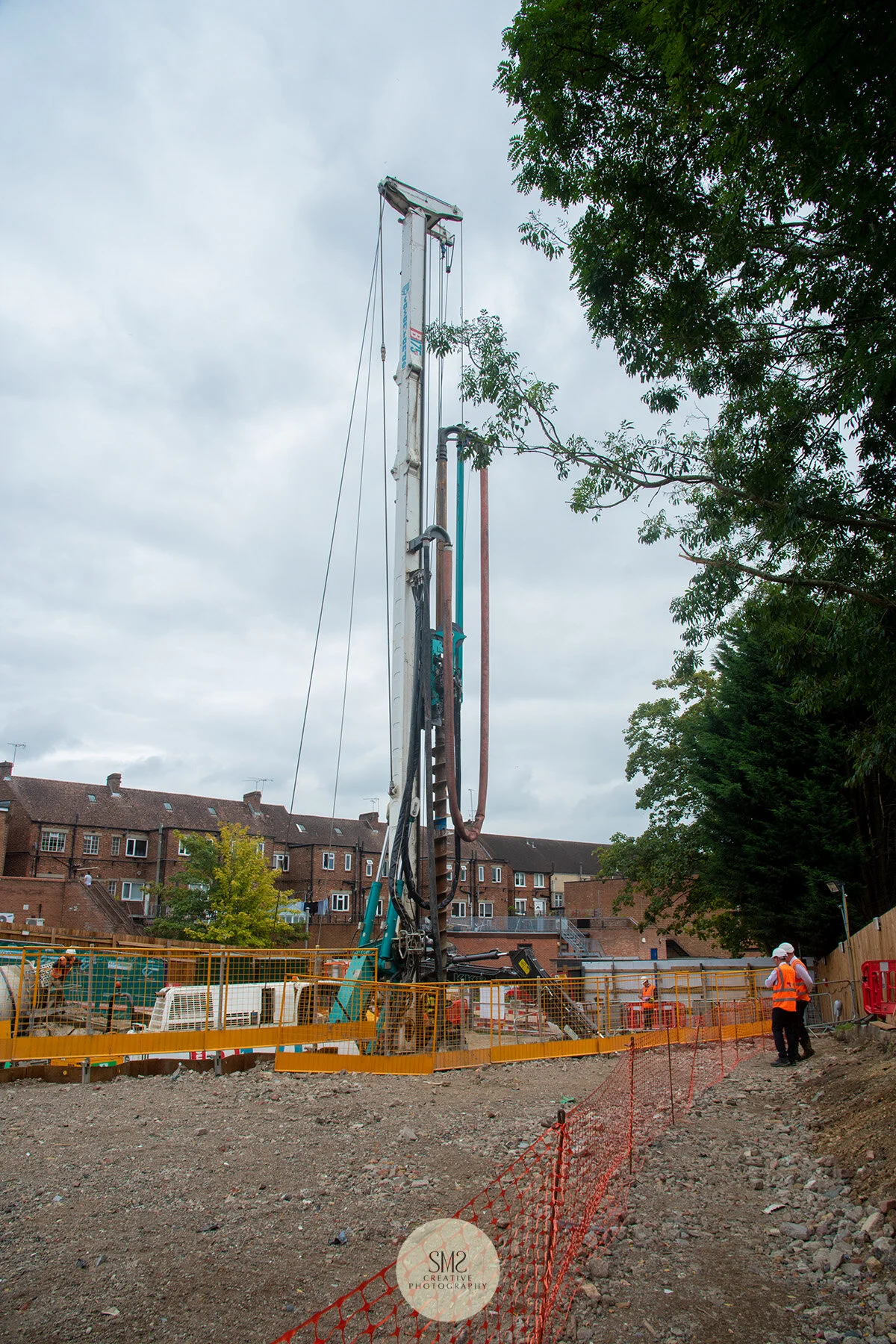 The auger, a machine that drills into the ground and pumps concrete into the space.