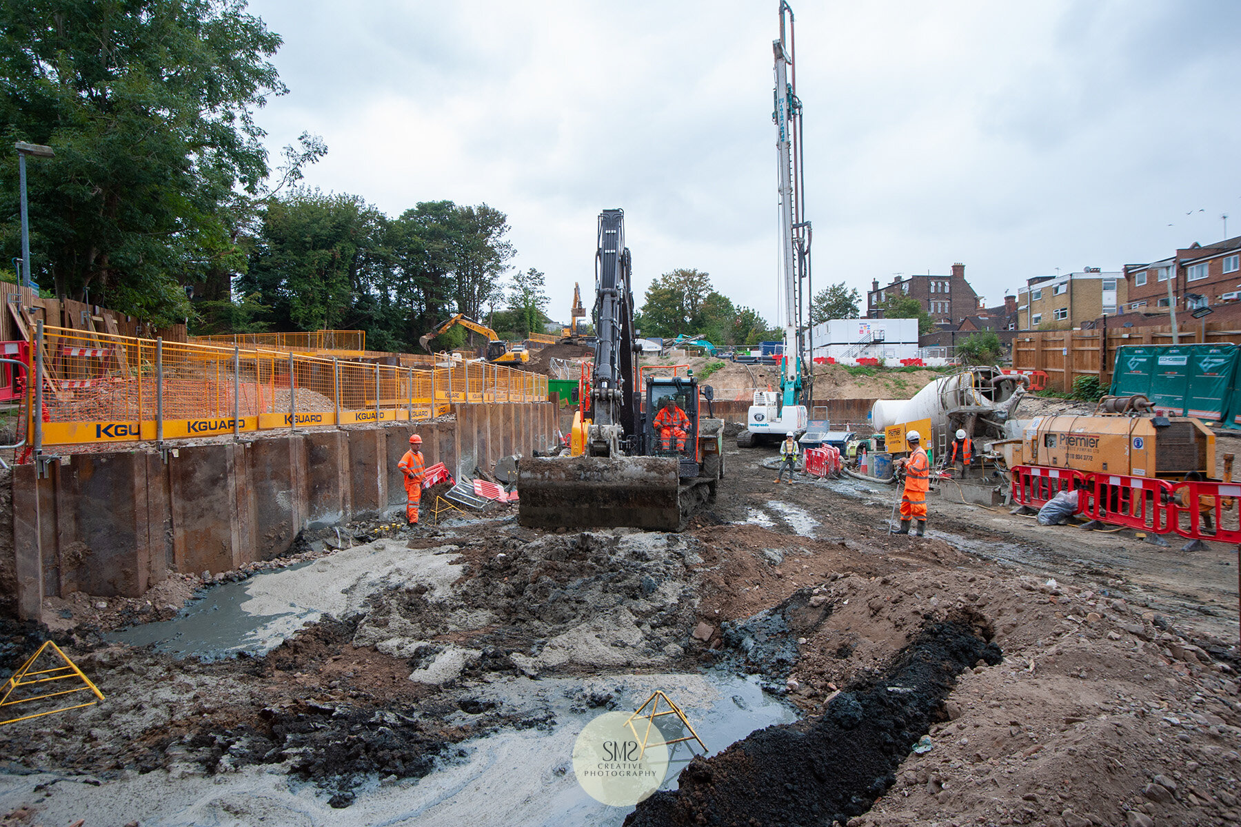  The digger scoops away the excess concrete from the surface. 