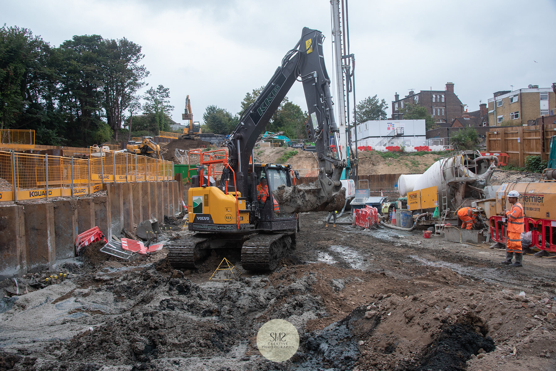   A yellow triangle shape is placed on the metal rods to identify where the foundation sits. 