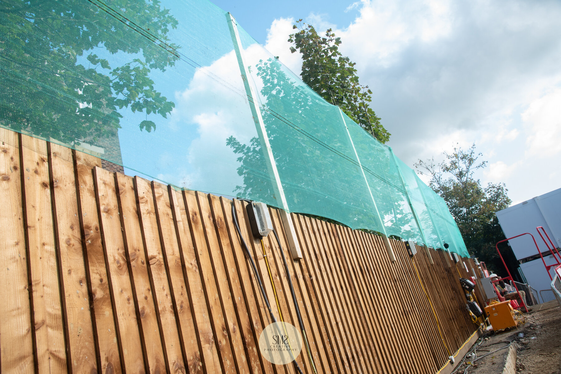  Netting to prevent any concrete splashing over the fence onto the back of the neighbouring premises. 