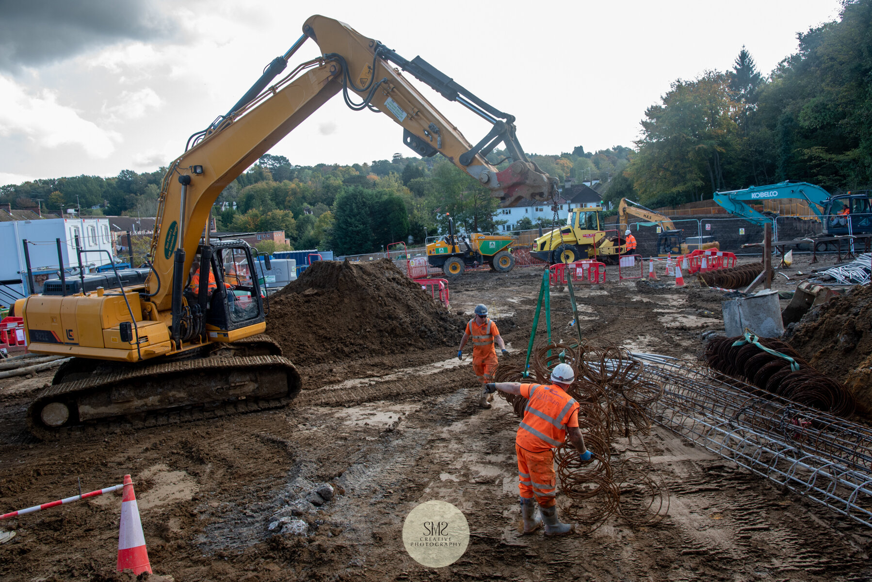  The positioning of the steel work for the making of the ‘cages. On the right of the picture completed ‘cages’ for inserting into the hole. 