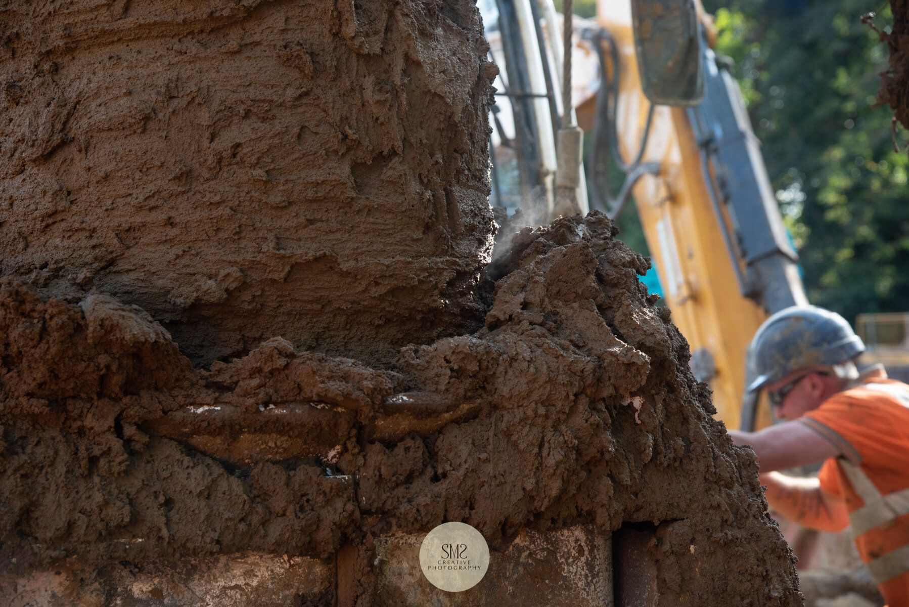  The auger digs deep into the ground to excavate the earth for foundations to be inserted. 