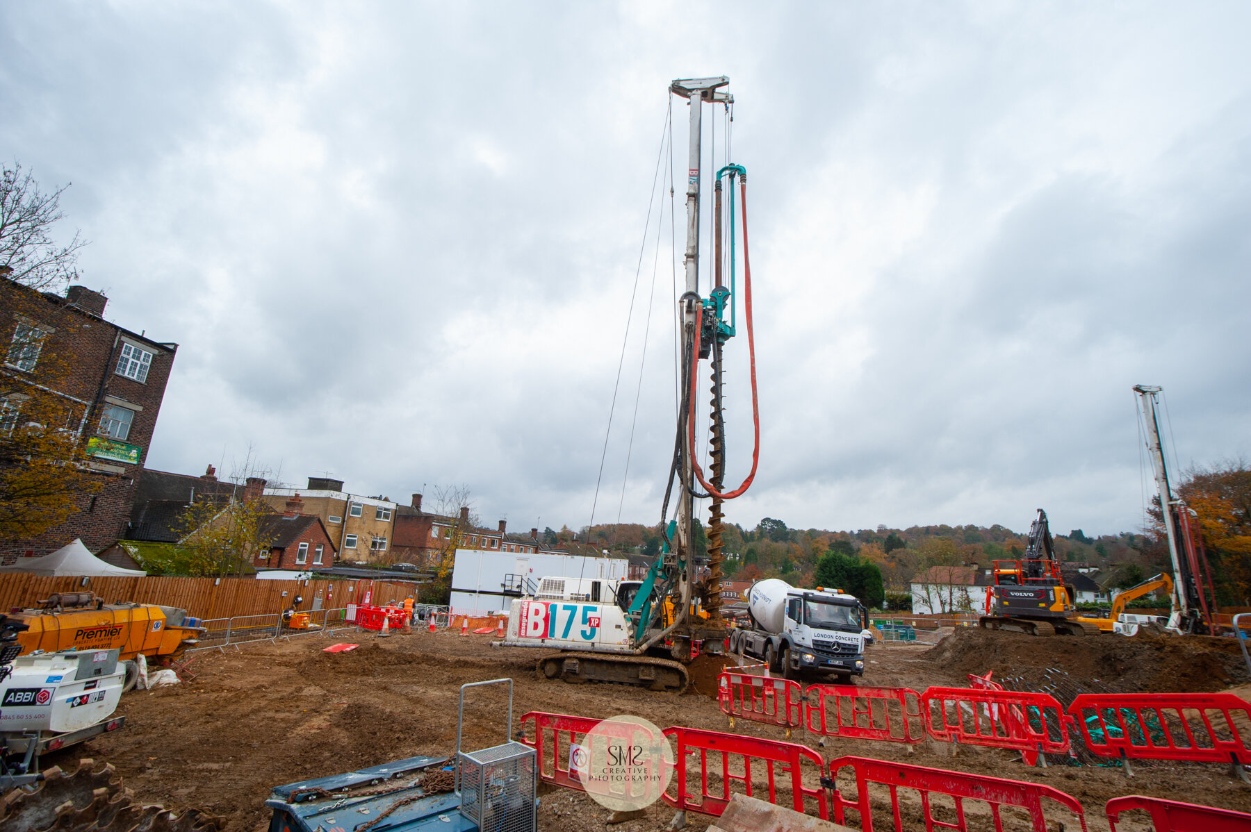  Two piling rigs taking on the task to complete the piling. The auger, the drill part of the rig bores a hole into the earth, then concrete is pumped into the hole in preparation for a steel ‘cage’ to be inserted. 