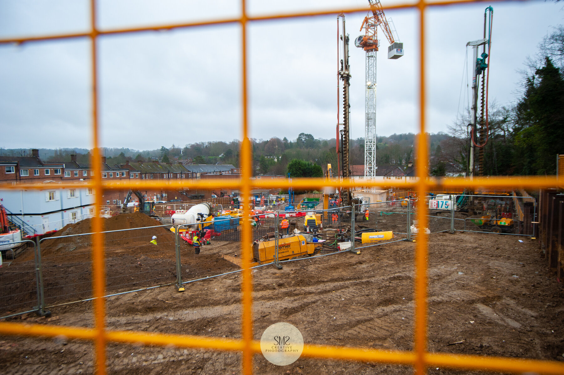  A look through the safety barriers at the piling rig and crane. The two piling rigs are responsible for the insertion of the 401 piles drilled into the ground. 